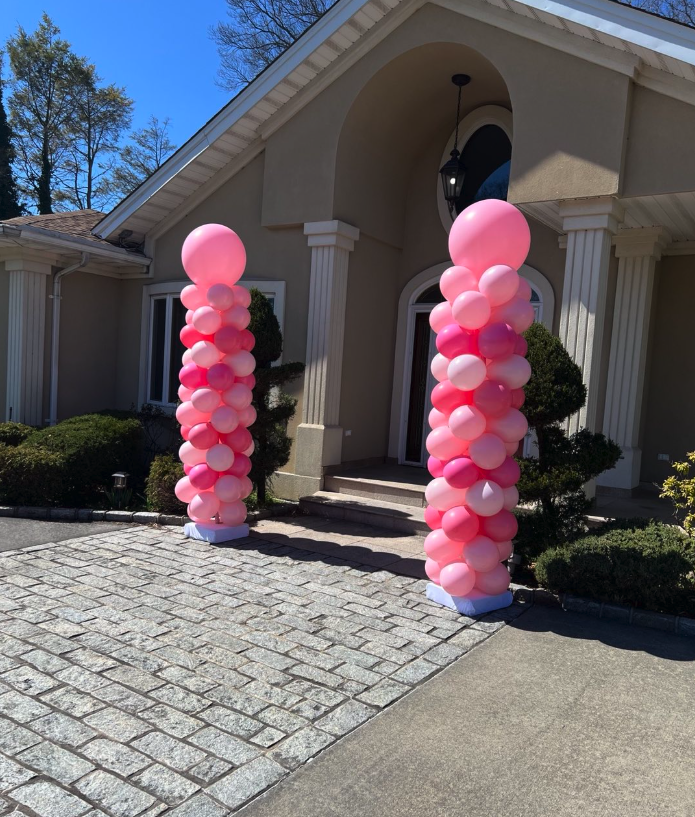 Pink balloon columns entrance decoration